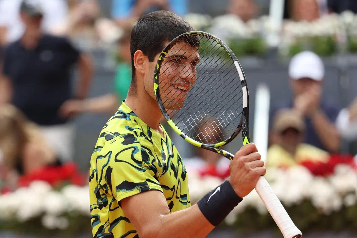 Spain's Carlos Alcaraz celebrates beating Germany's Alexander Zverev.