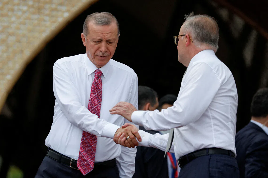 FILE PHOTO: Turkey's President Tayyip Erdogan shakes hands with Australia's Prime Minister Anthony Albanese before a MIKTA photo session amidst the G20 leaders' summit in Nusa Dua, Bali, Indonesia, November 15, 2022. REUTERS/Ajeng Dinar Ulfiana/Pool/File Photo