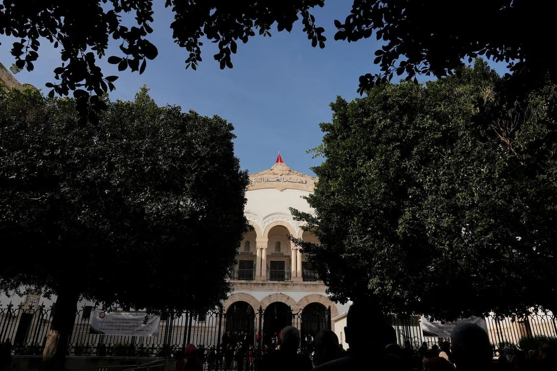 FILE PHOTO: Activists and members of human rights groups gather as they protest in front of Tunis courthouse in Tunis, Tunisia March 4, 2025. REUTERS/Jihed Abidellaoui/File Photo