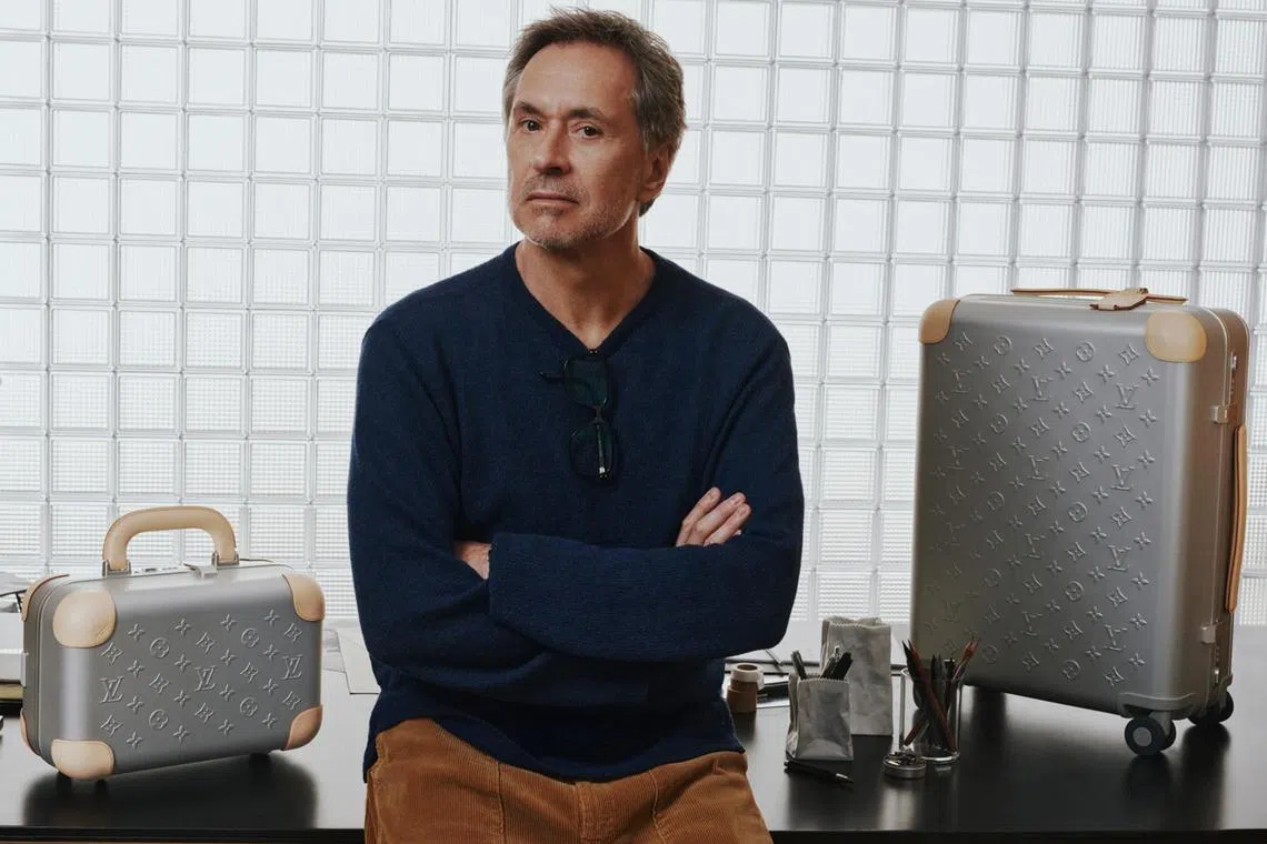 Marc Newson with the Horizon Aluminum suitcase and vanity case.