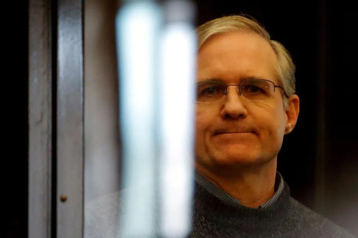 FILE PHOTO: Former U.S. Marine Paul Whelan, who was detained and accused of espionage, stands inside a defendants' cage during his verdict hearing in Moscow, Russia June 15, 2020. REUTERS/Maxim Shemetov/File Photo