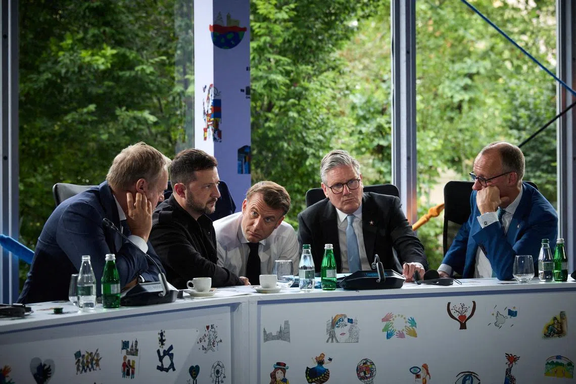 FILE PHOTO: Ukraine's President Volodymyr Zelenskiy, Britain's Prime Minister Keir Starmer, France's President Emmanuel Macron, German Chancellor Friedrich Merz and Polish Prime Minister Donald Tusk speak with U.S. President Donald Trump via phone during the European Political Community Summit inTirana, Albania May 16, 2025. Ukrainian Presidential Press Service/Handout via REUTERS/File Photo