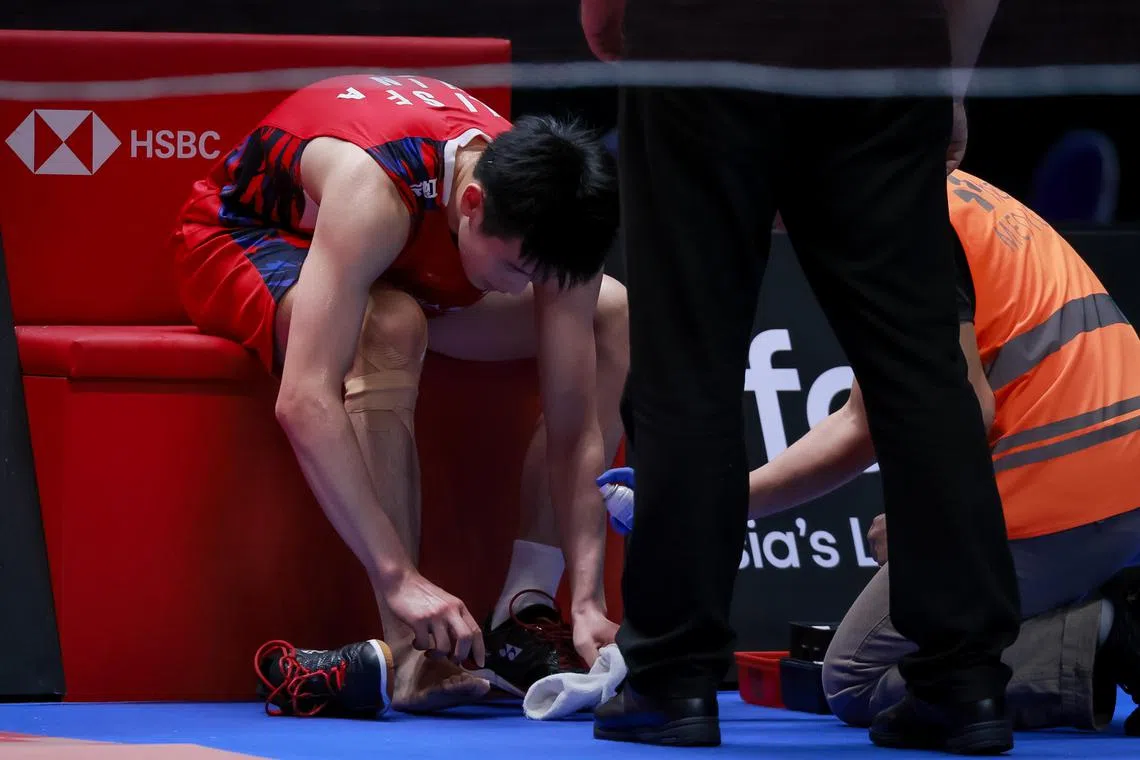 China's Li Shifeng during his medical timeout at the KFF Singapore Badminton Open men's singles quarter-finals held at Singapore Indoor Stadium on May 31, 2024.