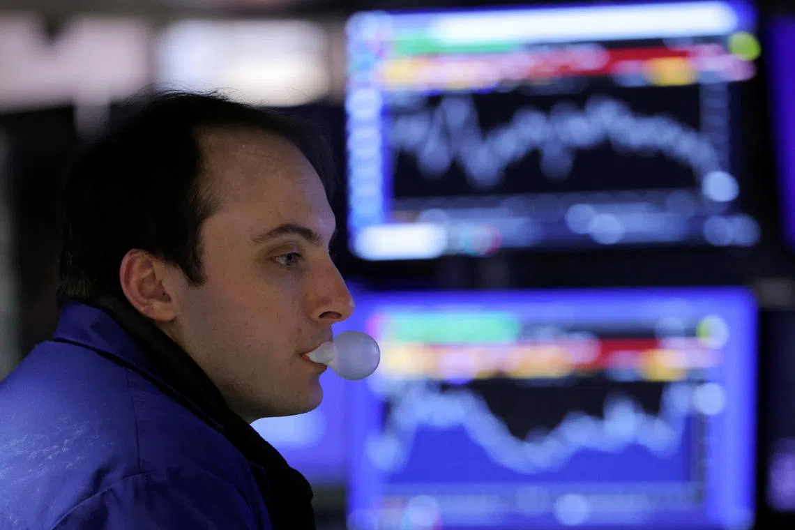 A trader works on the floor of the New York Stock Exchange, on March 15, 2023.
