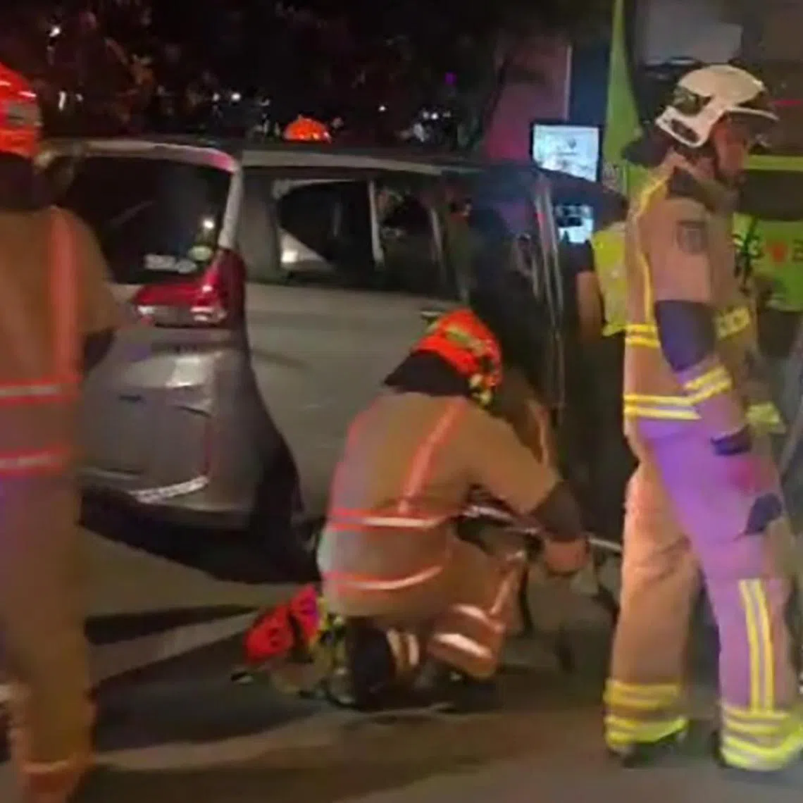 In photos of the accident, a silver car is seen crashed into the rear end of a Tower Transit bus.