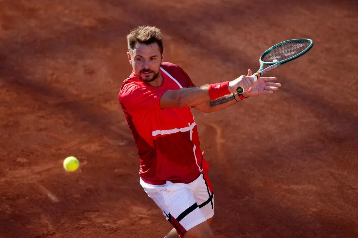 FILE PHOTO: Paris 2024 Olympics - Tennis - Men's Singles First Round - Roland-Garros Stadium, Paris, France - July 28, 2024. Stan Wawrinka of Switzerland in action during his first round match against Pavel Kotov of AIN. REUTERS/Aleksandra Szmigiel/File Photo