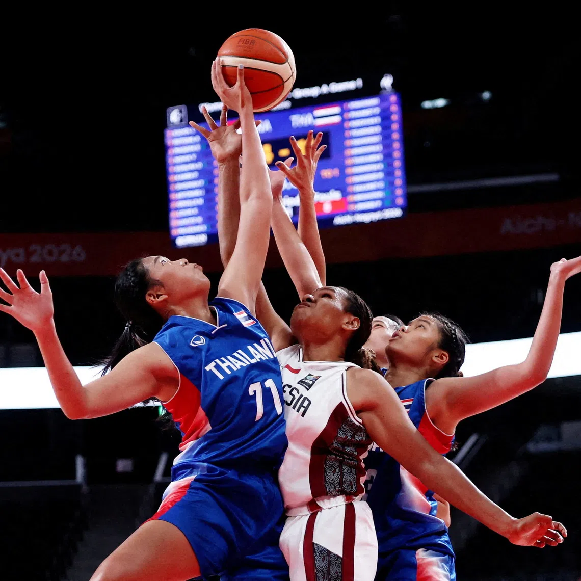 Asian Games - Aichi-Nagoya 2026 - Basketball - Women's - Group A - Indonesia v Thailand - Aichi International Arena, Nagoya, Japan - September 17, 2026 Thailand's Chosita Sakaret in action with Indonesia's Lea Kahol REUTERS/Edgar Su TPX IMAGES OF THE DAY