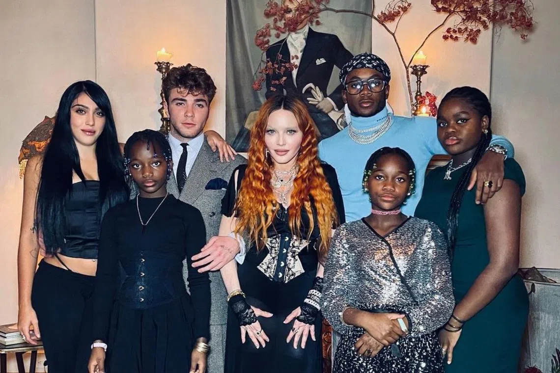 Singer Madonna (centre) shared rare photos of all six of her children together for Thanksgiving.