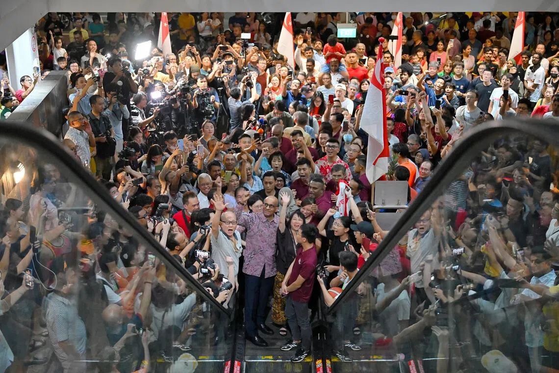 Landslide victory: Mr Tharman Shanmugaratnam surrounded by cheering supporters at Taman Jurong Market and Food Centre after the presidential election results were announced on Sept 1, 2023.