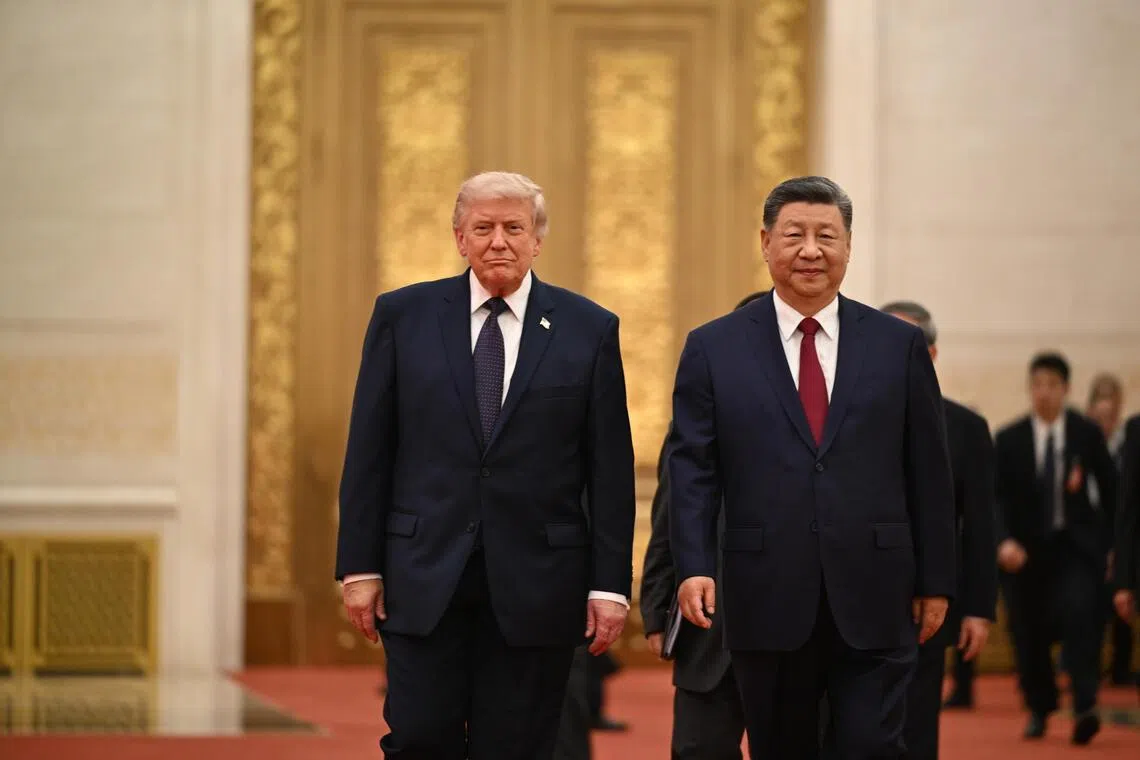 US President Donald Trump (left) and Chinese President Xi Jinping arriving for a state banquet at the Great Hall of the People in Beijing on May 14.