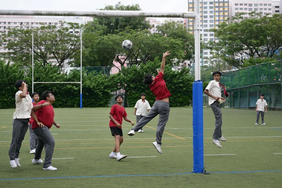 Bukit Batok Secondary students playing football during breaks in the school.