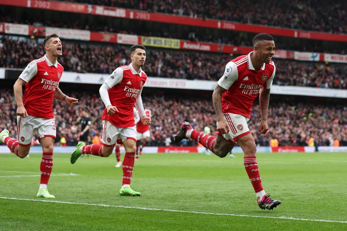 Arsenal's Gabriel Jesus celebrates scoring their third goal with Granit Xhaka and Gabriel Martinelli.