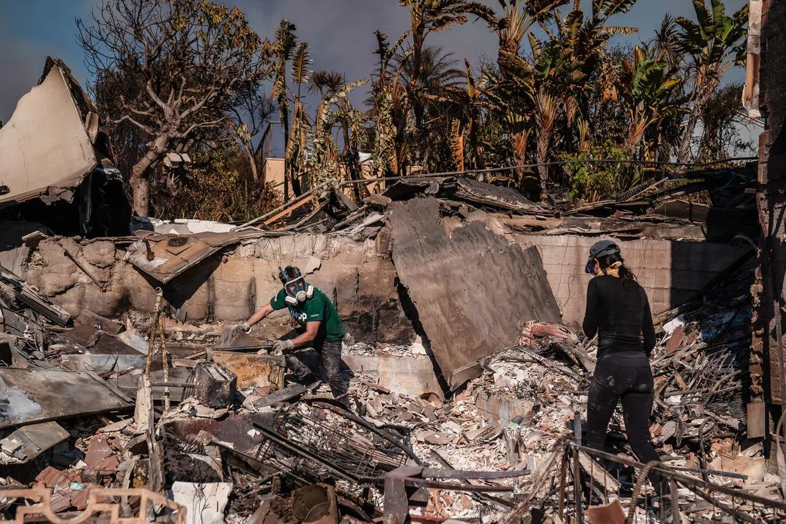 The fires have killed at least 24 people and destroyed thousands of homes. 