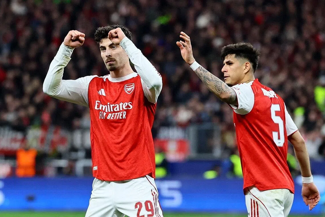 Soccer Football - UEFA Champions League - Round 16 - First Leg - Bayer Leverkusen v Arsenal - BayArena, Leverkusen, Germany - March 11, 2026
Arsenal's Kai Havertz celebrates scoring their first goal with Piero Hincapie REUTERS/Wolfgang Rattay     TPX IMAGES OF THE DAY     