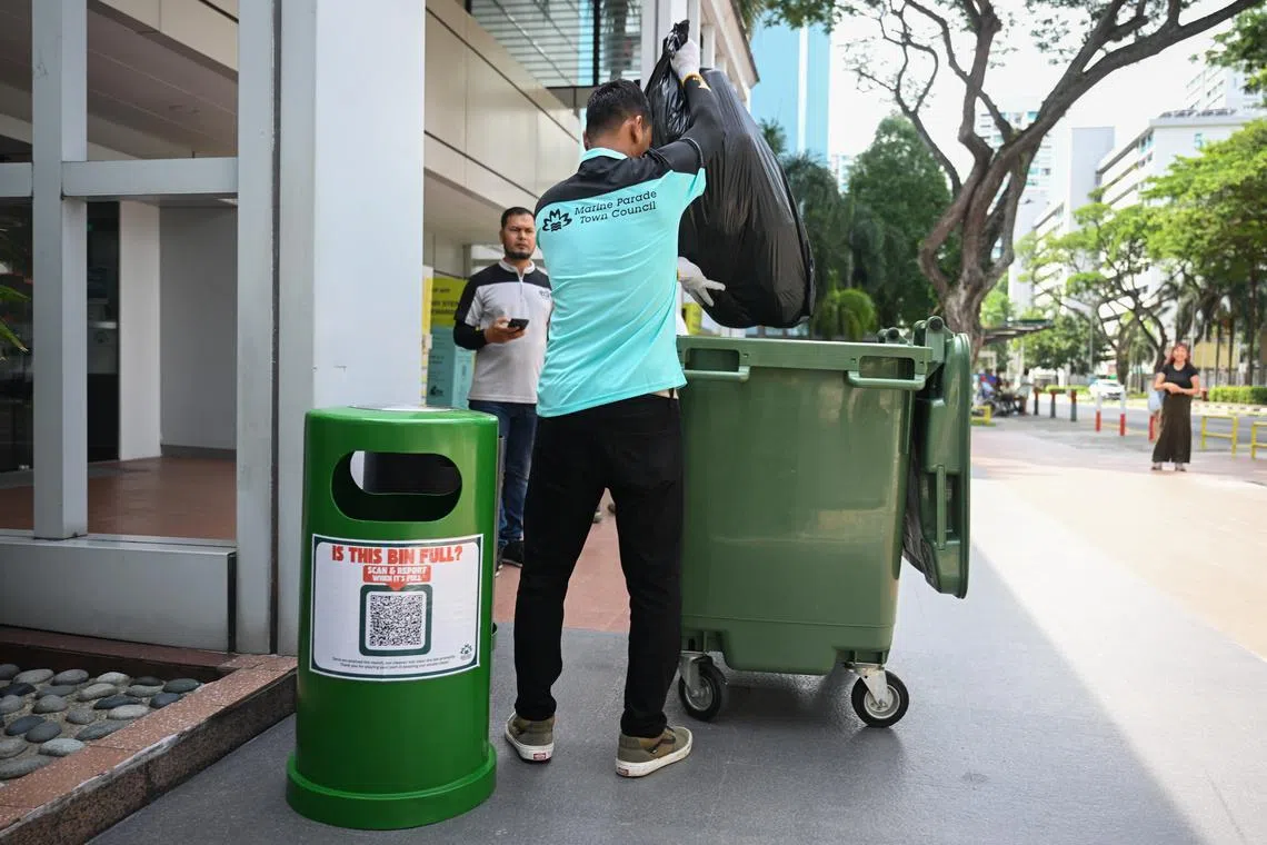 Demonstration of the QR code-enabled reporting system at Marine Parade-Braddell Heights Town Council main office on May 22.