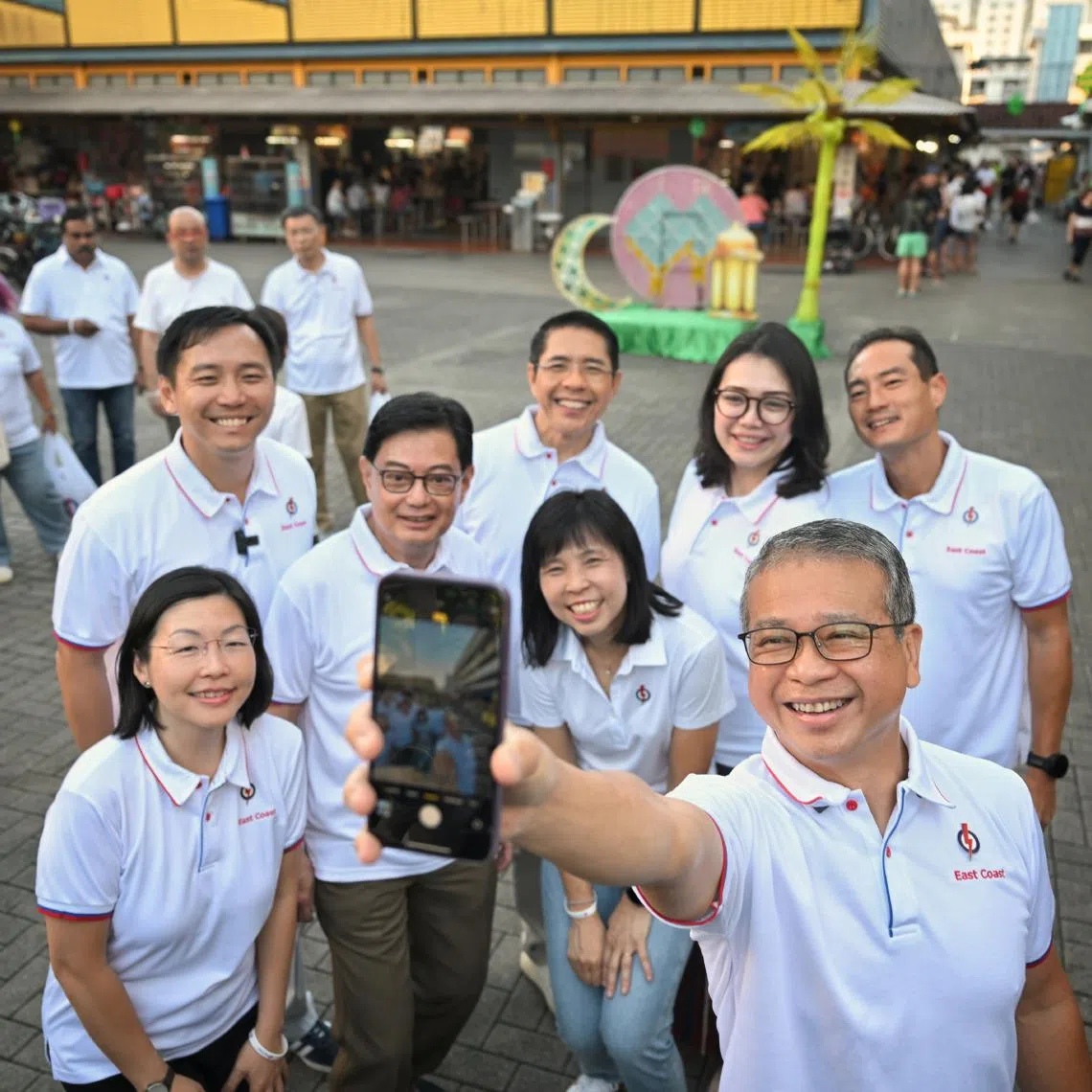 Former brigadier-general Goh Pei Ming (second row; far left) and Madam Hazlina Abdul Halim (second row; second from right), the former chief executive of Make-A-Wish Singapore, joined five East Coast MPs and Joo Chiat MP Edwin Tong on a walkabout at Bedok 85 Market on April 12.
