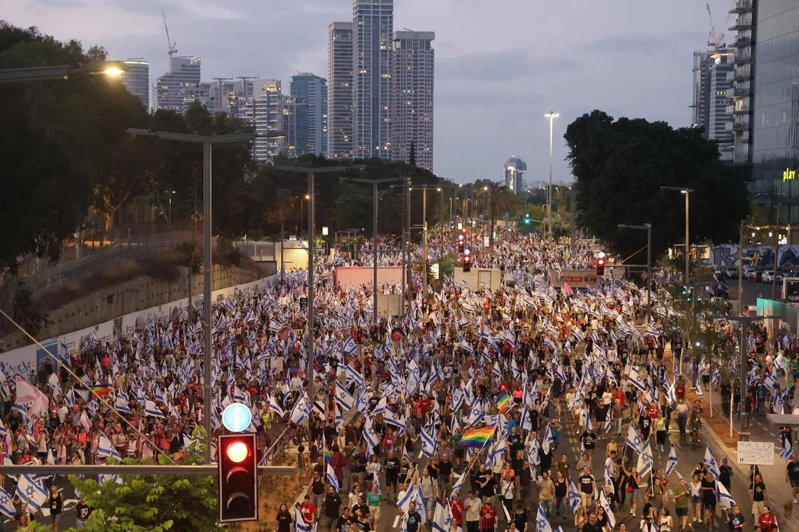 Flag-waving protesters beat drums and sounded horns, as thousands took to the streets to protest against the government's judicial overhaul.