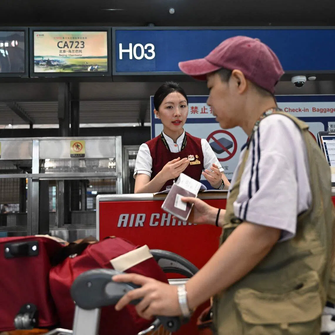 A passenger at Beijing International Airport. Foreign visitors are advised to stick closely to their declare travel purposes.
