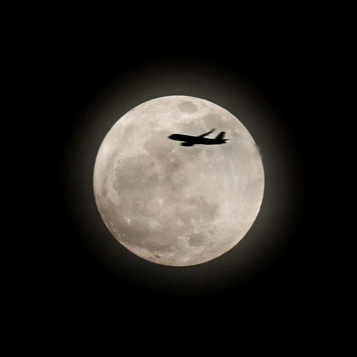A supermoon occurs when a full moon coincides with the point in its orbit closest to Earth, making it appear about 6 to 7 per cent larger and brighter than usual. This photo is of the first supermoon of 2024, the sturgeon moon, as seen from East Coast Park on Aug 19, 2024.