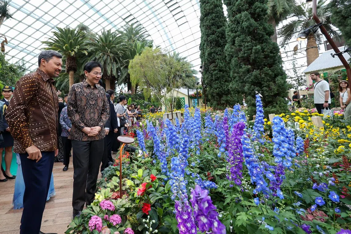 PM Lawrence Wong and Brunei Crown Prince Haji Al-Muhtadee Billah touring the Impressions of Monet exhibition at Gardens by the Bay on Sept 13.