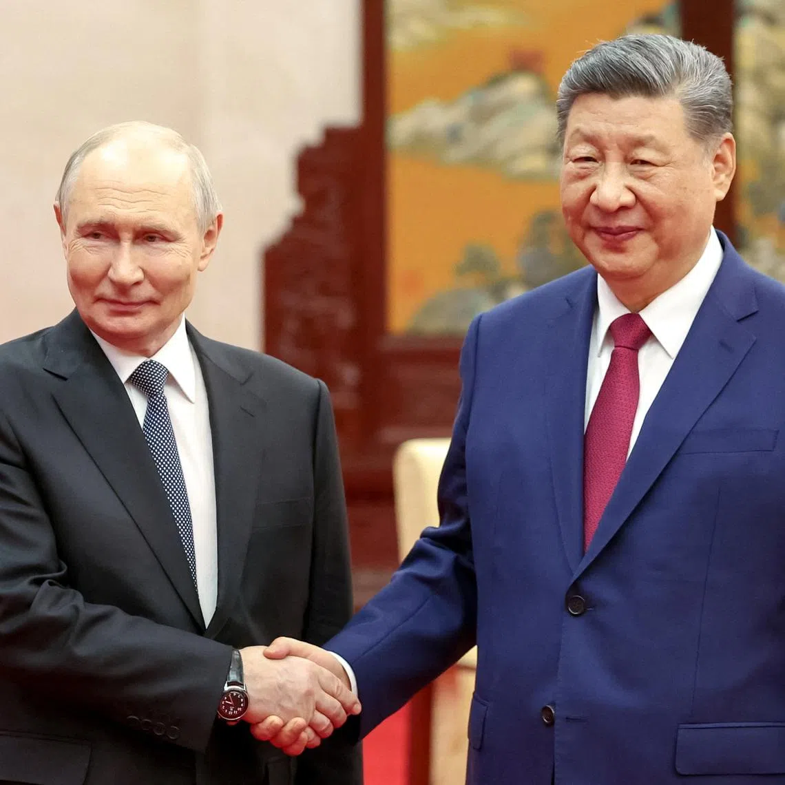 Russian President Vladimir Putin (left) and Chinese President Xi Jinping following their meeting at the Great Hall of the People in Beijing, on May 20.