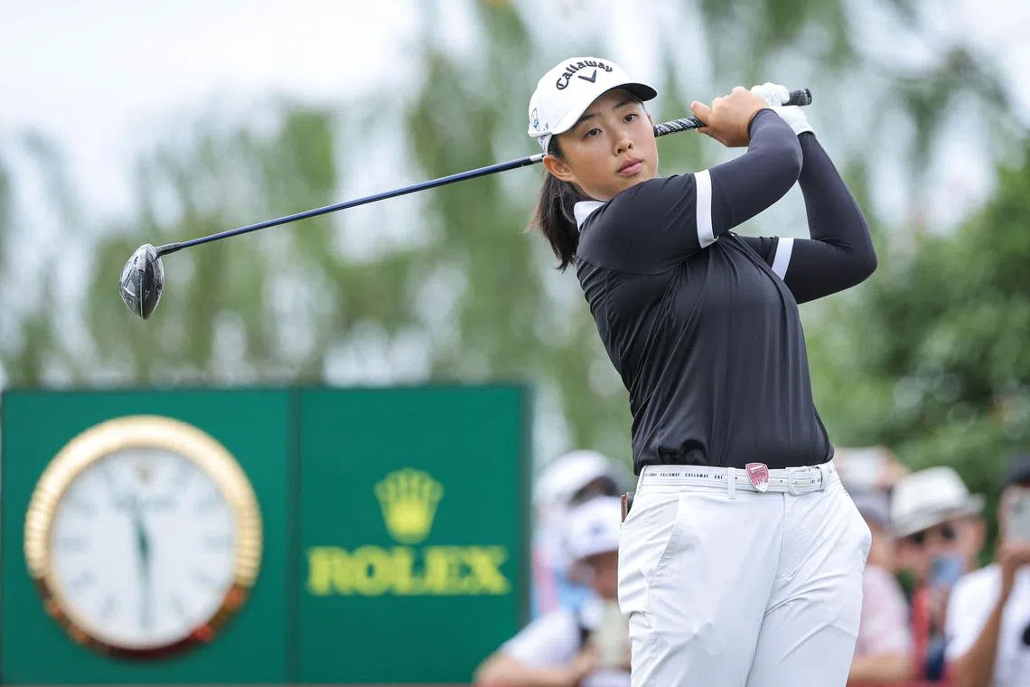Yin Ruoning of China hits a tee shot in the final round of the Shanghai LPGA golf tournament on Oct 13, 2024. She romped to a six-shot win.