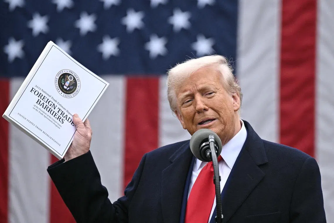 US President Donald Trump delivers remarks on reciprocal tariffs at the White House in Washington on April 2.