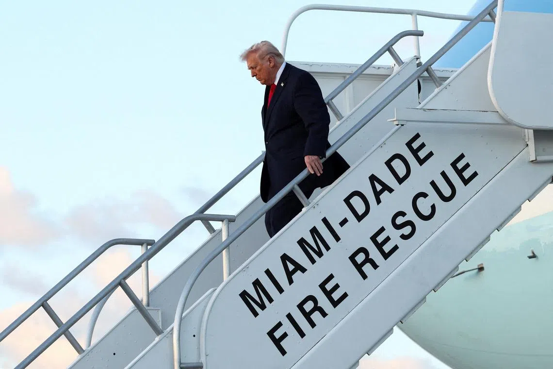 U.S. President Donald Trump exits Air Force One as he arrives at Miami International Airport in Florida, U.S., April 11, 2026.  REUTERS/Kevin Lamarque