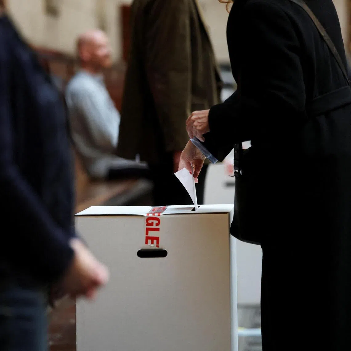A person votes at a polling station during parliamentary elections in Copenhagen, Denmark.
