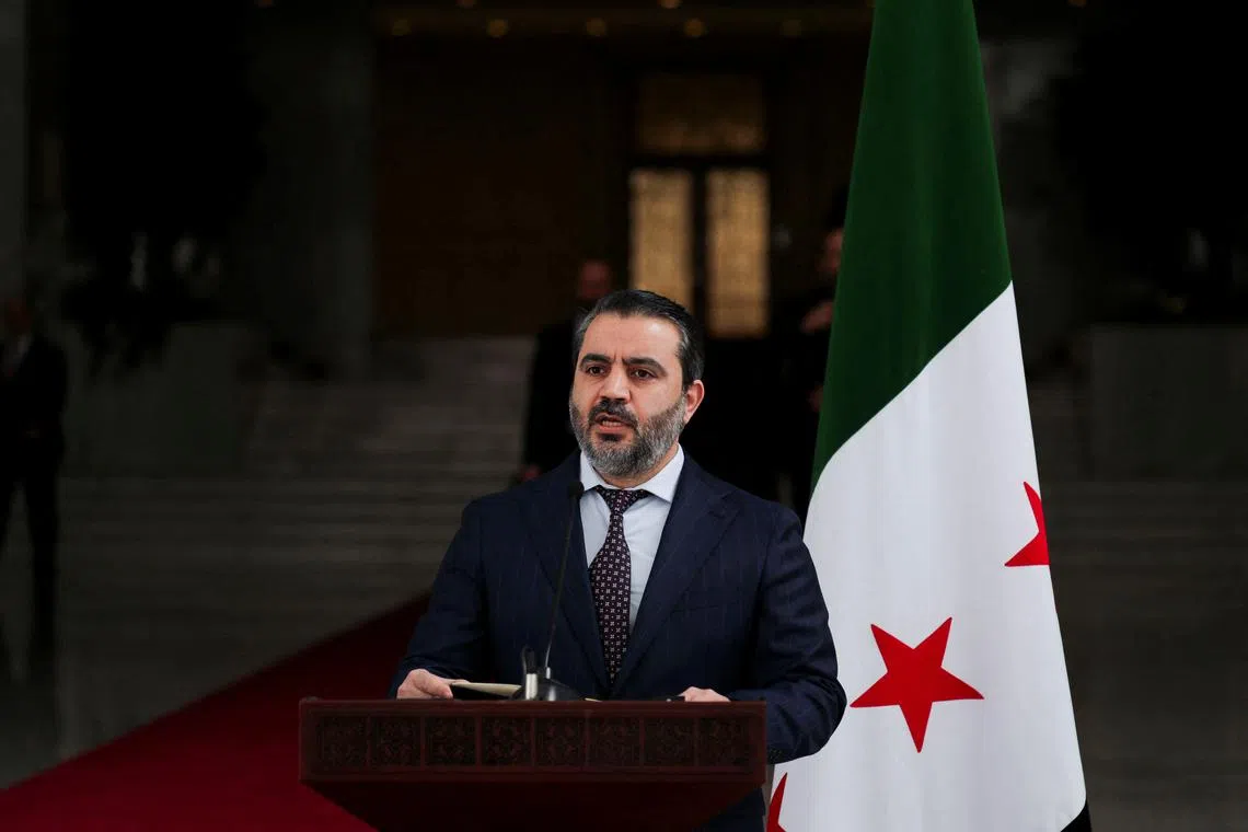 Syria's foreign minister, Asaad Hassan al-Shibani, speaks during a press conference with Ukrainian Foreign Minister Andrii Sybiha (not pictured), after the ousting of Syria's Bashar al-Assad, in Damascus, Syria, December 30, 2024. REUTERS/Khalil Ashawi/File Photo