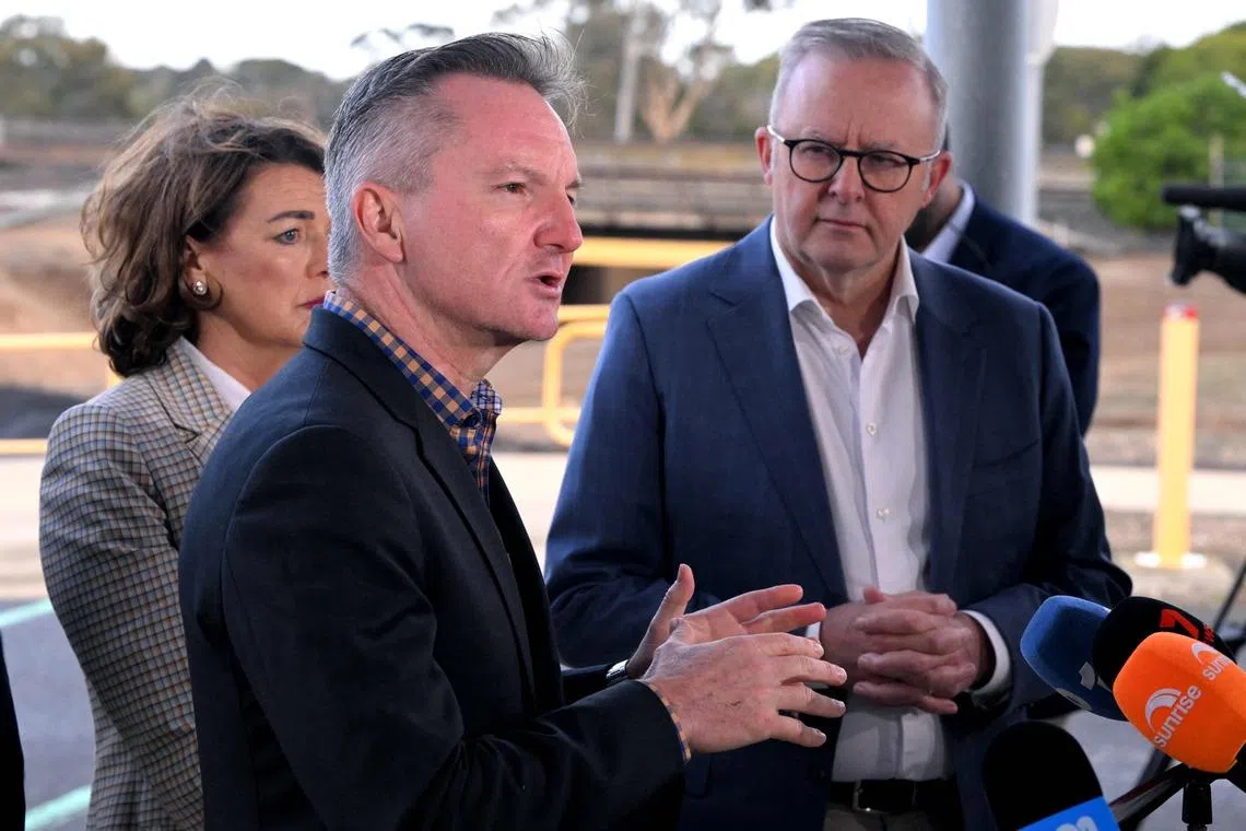 Minister for Climate Change and Energy Chris Bowen speaks as Australia's Prime Minister Anthony Albanese watches on.