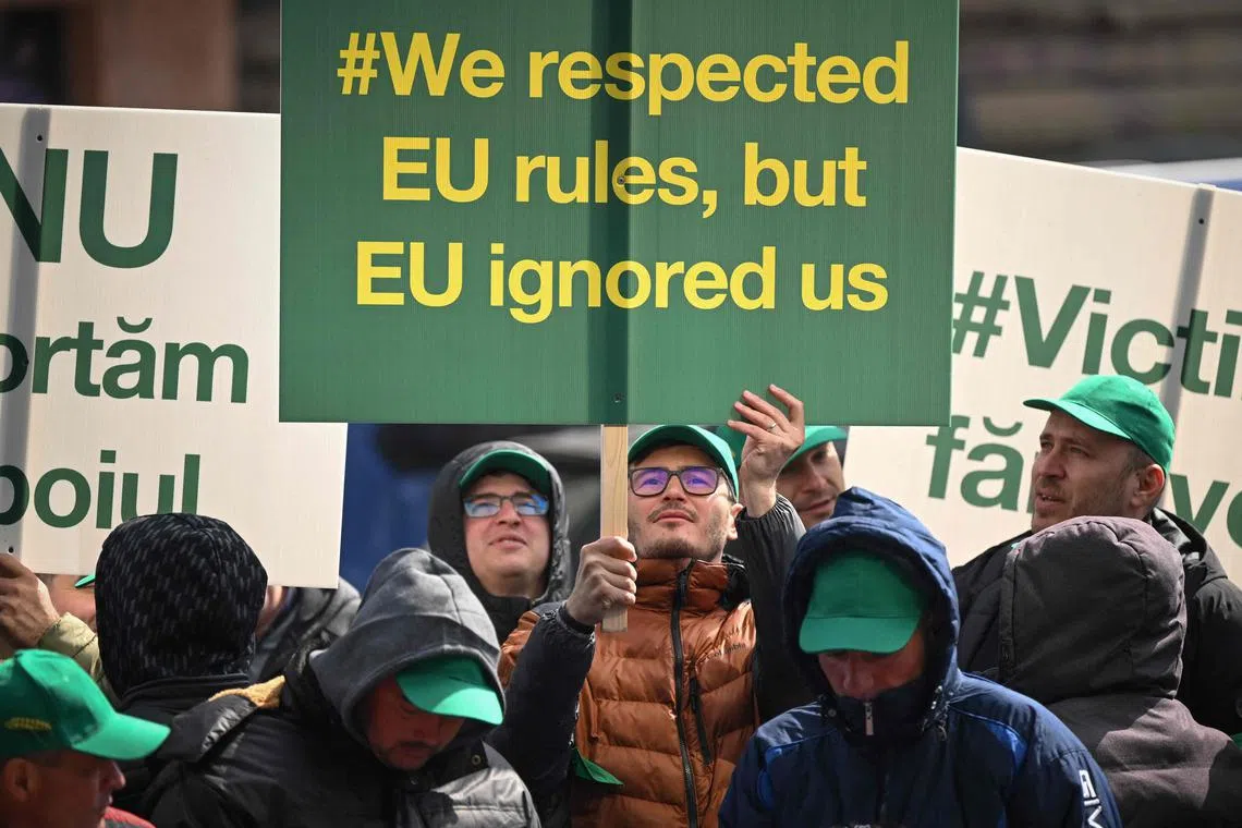 Romanian farmers protest in the front of the European Commission headquarters in Bucharest on April 7, 2023. 