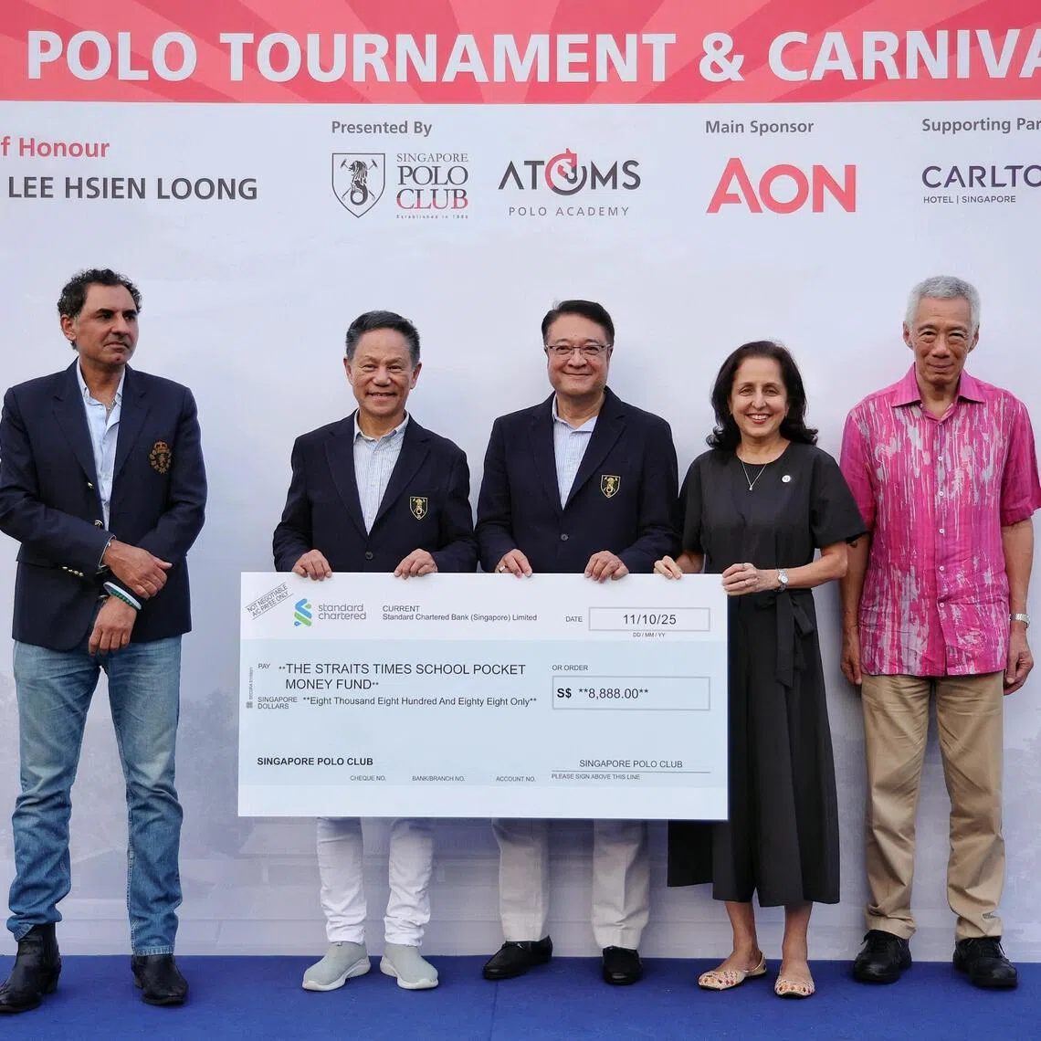 (From right) Senior Minister Lee Hsien Loong, ST associate editor Karamjit Kaur, and the Singapore Polo Club's general manager Sylvan Braberry, president Lawrence Khong and polo captain Satinder Garcha at the cheque presentation ceremony on Oct 11.