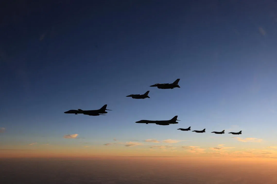 Members of Japan's Self-Defence Forces and US Armed Forces conducting a joint military drill off Kyushu island on Nov 5, 2022.