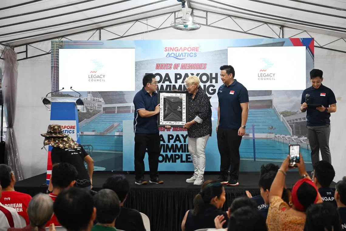Mr Alan Goh (extreme left), CEO of Sports Singapore, receives a token of appreciation from Patricia Chan and SAQ president Mark Chay after launching the Legacy Council logo during the Farewell to Toa Payoh party on Sunday, October 15, at the Toa Payoh Sports Centre. 

ST Photo: Azmi Athni