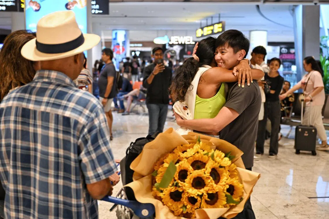 Singapore Sprint Queen Shanti Pereira being surprised by her partner Tan Zong Yang at Changi Airport on Sep 8, 2023.