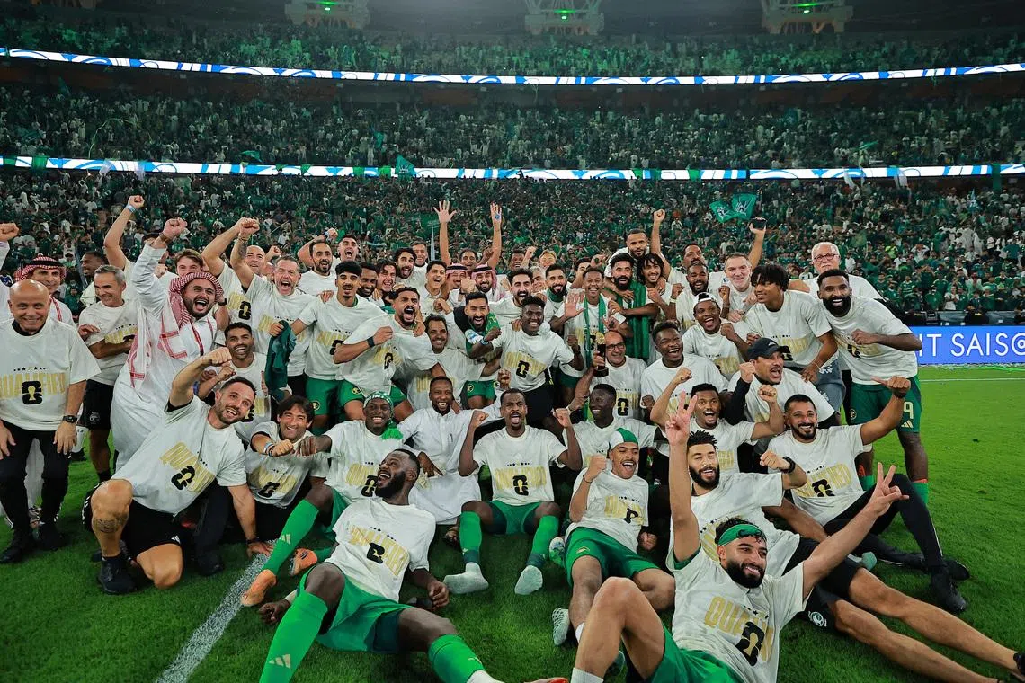 Soccer Football - FIFA World Cup - AFC Qualifiers - Group B - Saudi Arabia v Iraq - King Abdullah Sports City, Jeddah, Saudi Arabia - October 14, 2025 Saudi Arabia players celebrate after qualifying for the FIFA World Cup REUTERS/Stringer