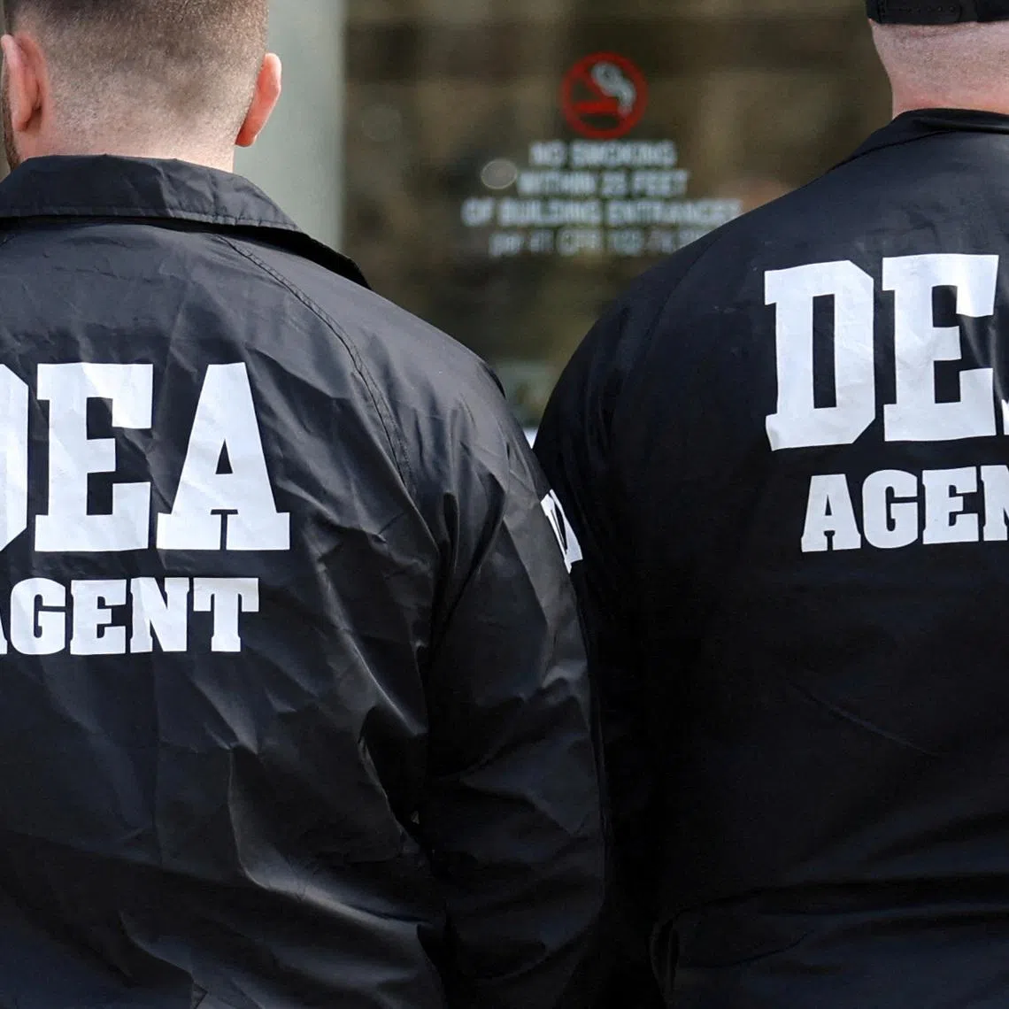 FILE PHOTO: Members of the Drug Enforcement Administration (DEA) stand outside the Brooklyn Federal Courthouse in Brooklyn, New York, U.S., March 26, 2025. REUTERS/Kylie Cooper/ File Photo