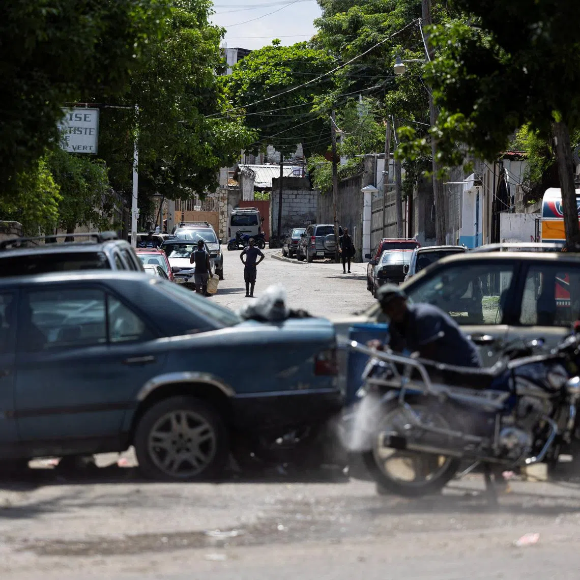 A view of a makeshift barricade built by residents out of abandoned vehicles to block a road and prevent gangs from entering their community, in Port-au-Prince, Haiti May 5, 2024. REUTERS/Ricardo Arduengo