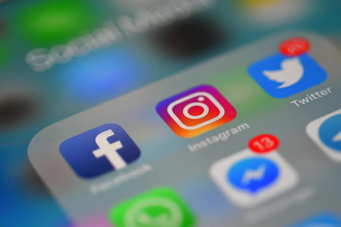 Generic photo of social media apps Facebook, Instagram and Twitter on a handphone, 10 March 2018.