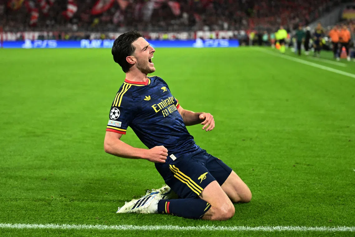 Soccer Football - UEFA Champions League - Bayern Munich v Arsenal - Allianz Arena, Munich, Germany - October 21, 2026  Arsenal's Declan Rice celebrates scoring their second goal REUTERS/Angelika Warmuth