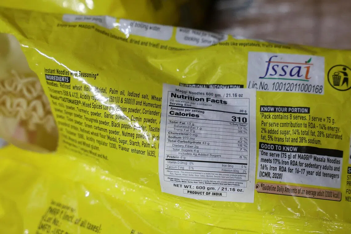 A modified label pasted over the original nutrition facts information on a packet of Maggi.