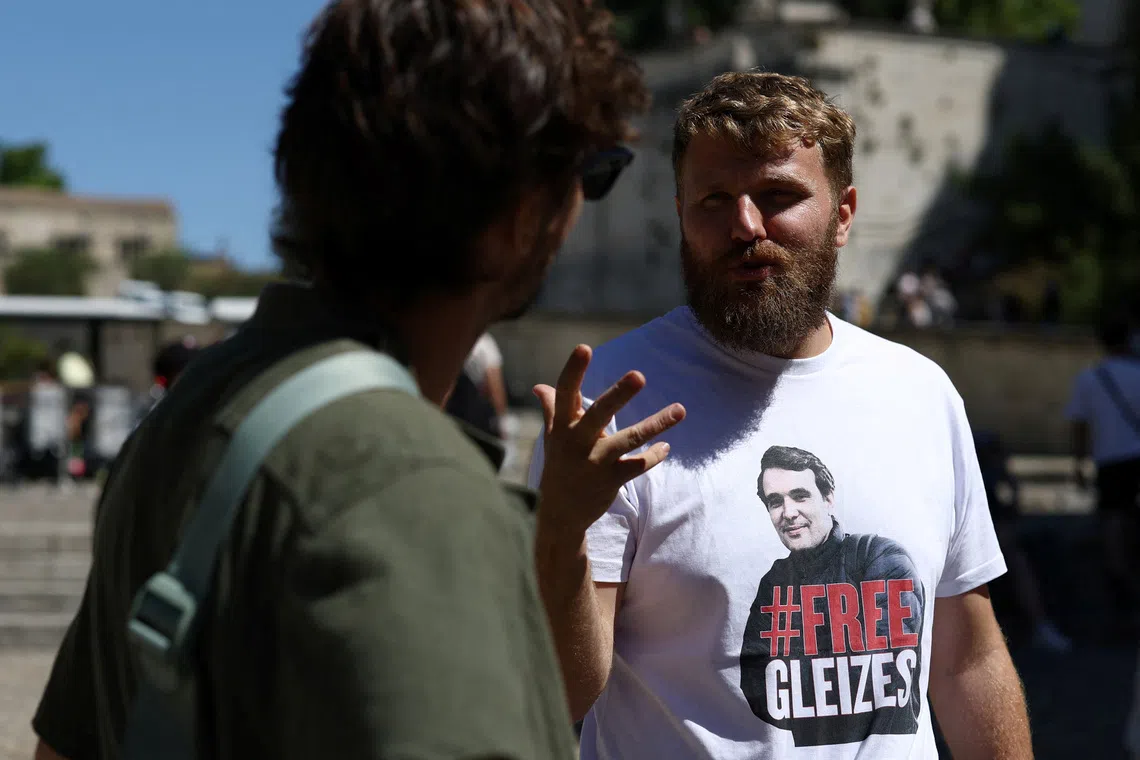 Maxime Gleizes, brother of French journalist Christophe Gleizes, who was sentenced to seven years in prison by an Algerian court, speaks with supporters during a march calling for his brother’s release, in Avignon, France, July 16, 2025. REUTERS/Manon Cruz