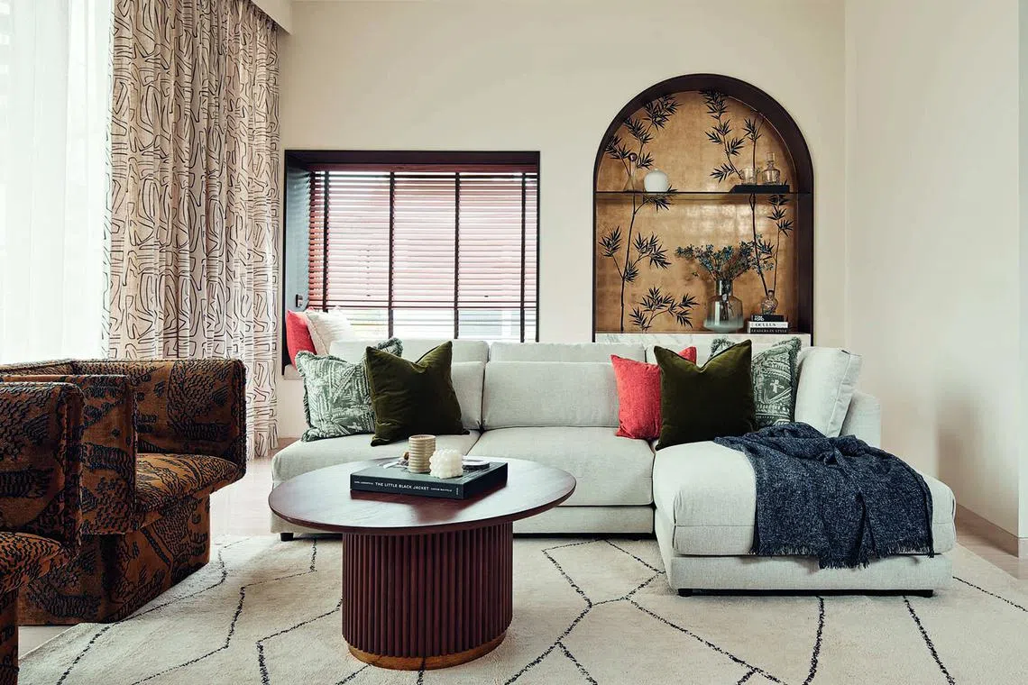 To achieve the owners’ desired Art Deco style, the designers of this River Valley penthouse unit incorporated colonial-era decor with rattan, dark woods and classic wall mouldings in white.  