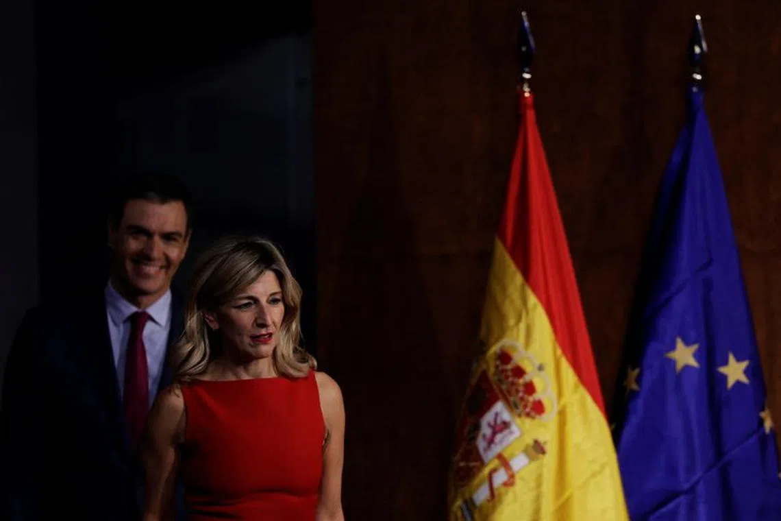 Spain's left-wing Sumar leader and acting Labor Minister Yolanda Diaz and Spain’s acting Prime Minister Pedro Sanchez arrive to sign a government coalition agreement in Madrid, Spain, October 24, 2023. REUTERS/Susana Vera