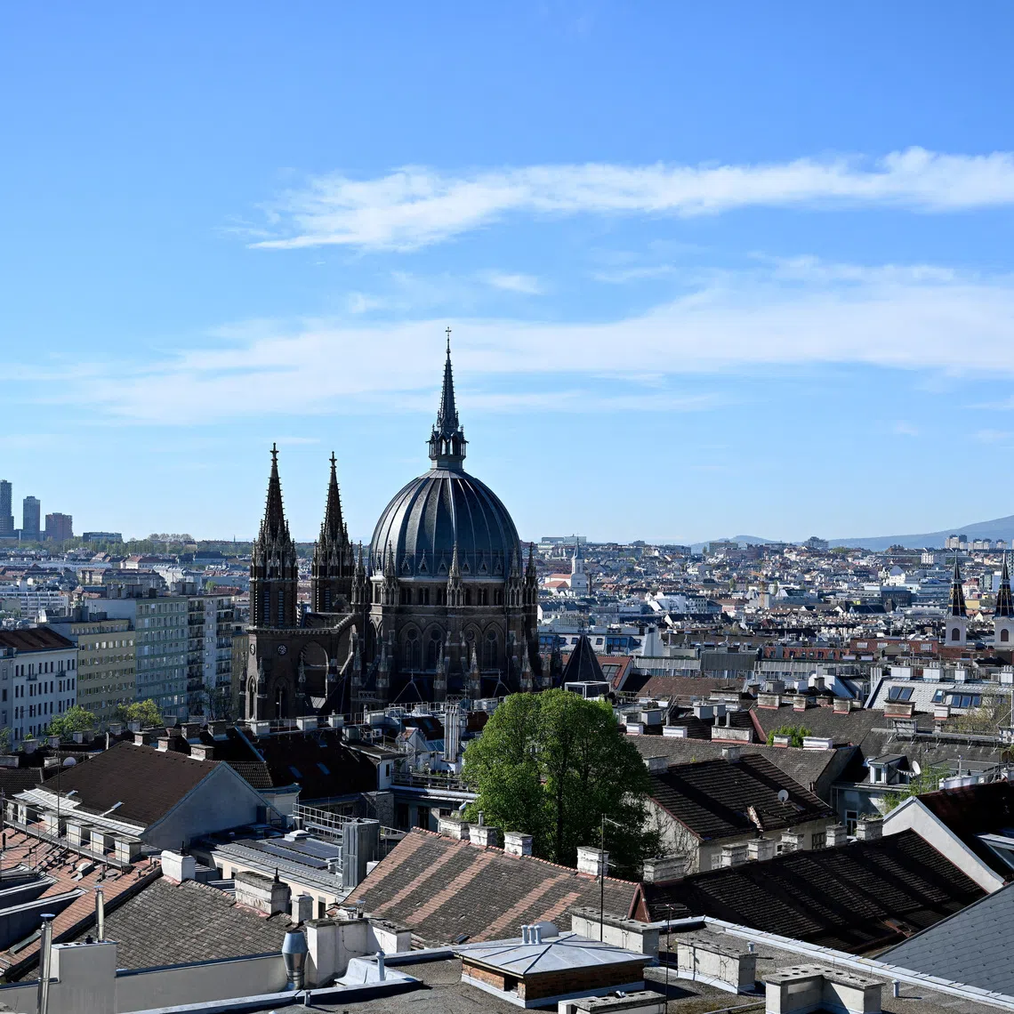 FILE PHOTO: A general view of the cityscape of Vienna with the Maria vom Siege church in front, Austria, April 16, 2025. REUTERS/Elisabeth Mandl/File Photo