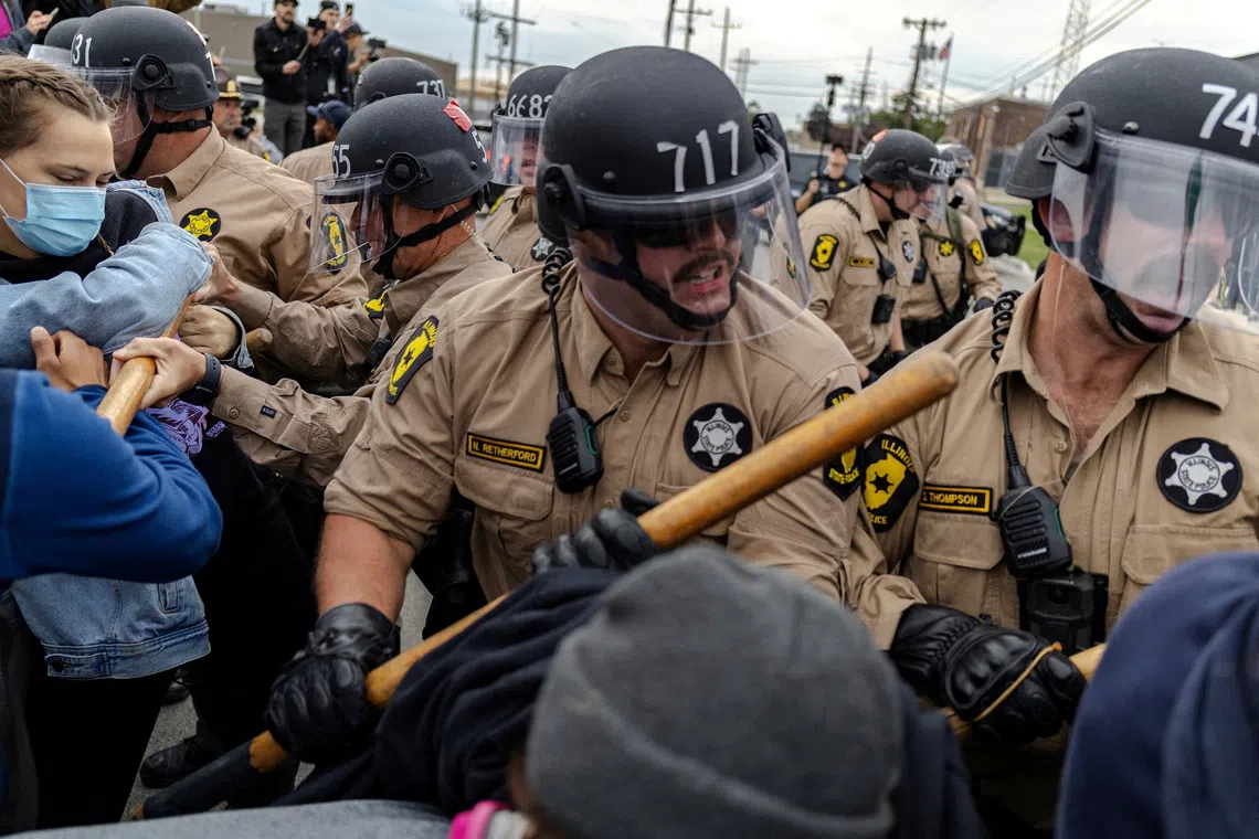 FILE PHOTO: Members of the Illinois State police clash with protesters outside of the Broadview ICE facility, after U.S. President Donald Trump ordered increased federal law enforcement presence to assist in crime prevention, in Chicago, Illinois, U.S., October 17, 2025.  REUTERS/Jim Vondruska/File Photo
