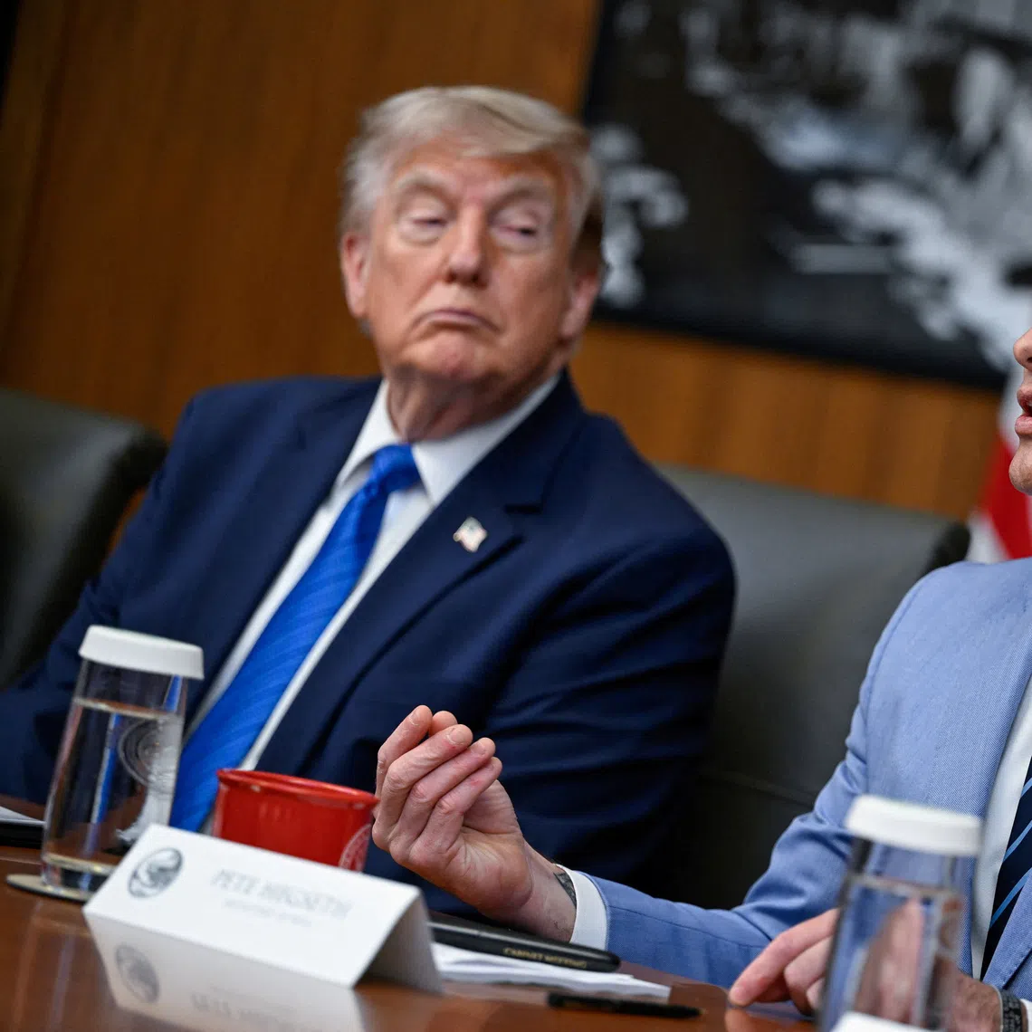 US President Donald Trump listens as Secretary of Defense Pete Hegseth speaks during a cabinet meeting on Jul 31.