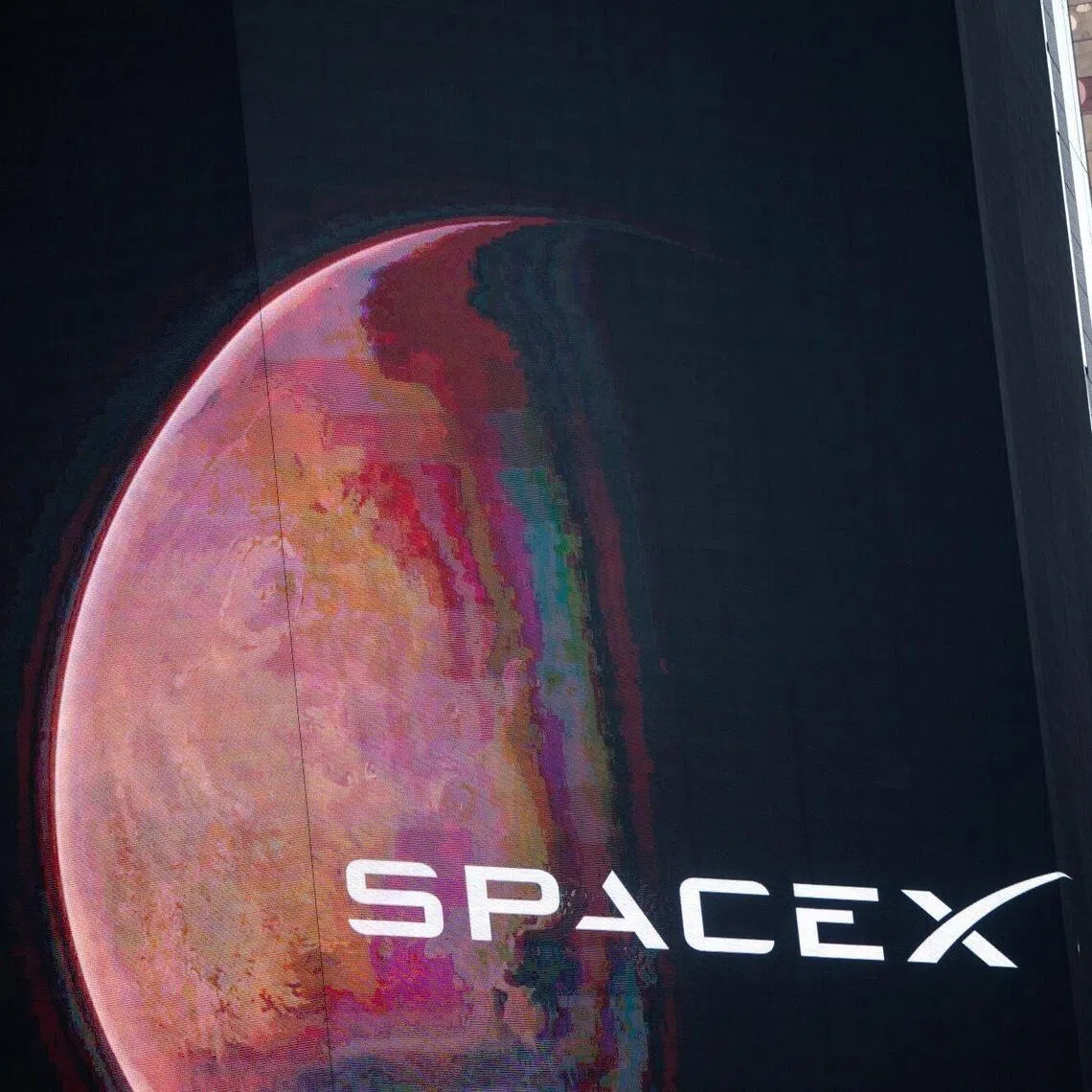 SpaceX signage at the Nasdaq MarketSite after the company's initial public offering in New York on June 12, 2026. 