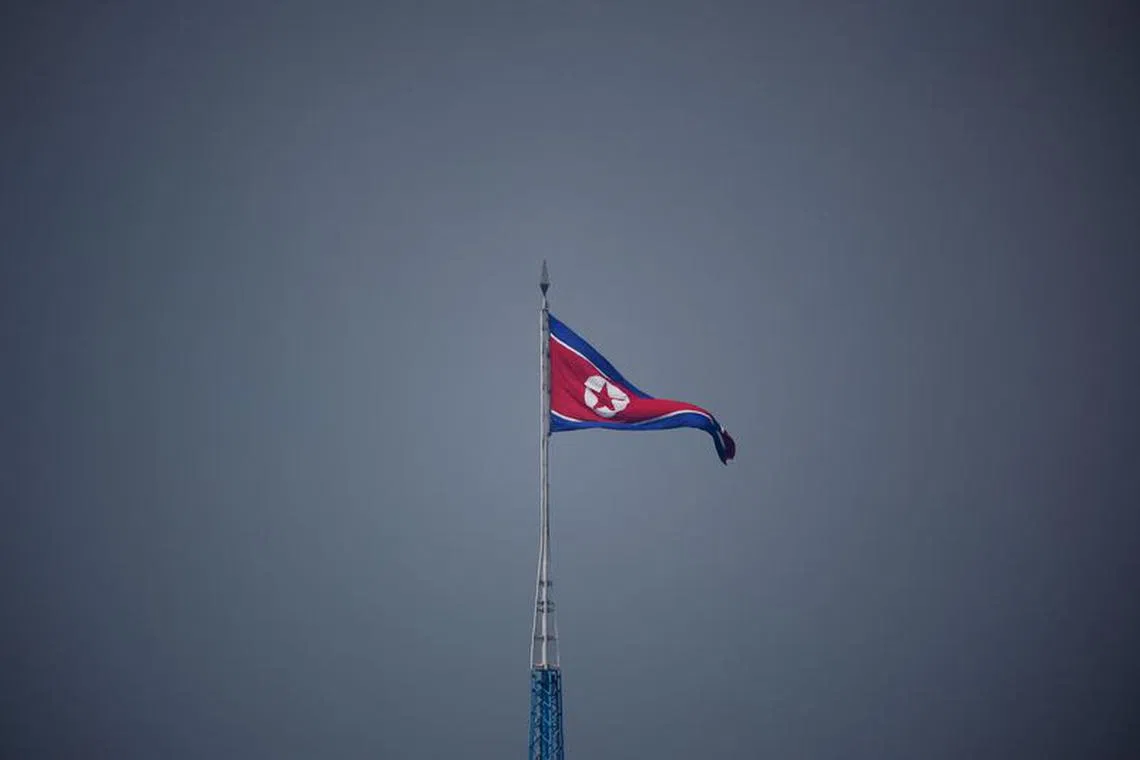 A North Korean flag flutters at the propaganda village of Gijungdong in North Korea, in this picture taken near the truce village of Panmunjom inside the demilitarized zone (DMZ) separating the two Koreas, South Korea, July 19, 2022.    REUTERS/Kim Hong-Ji/Pool/ File Photo